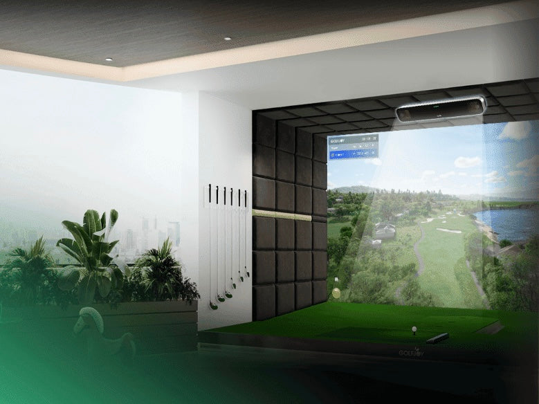 Indoor golf simulator with a screen displaying a golf course.
